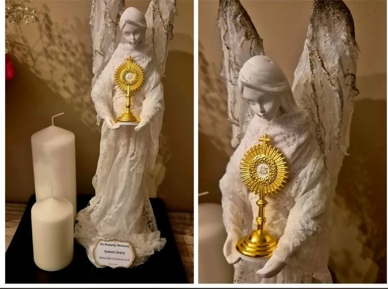 White religious statue of Saint holding a golden sunflower ornament, displayed with a white candle